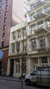 A proposed restoration of 102 Greene Street would restore the missing top two floors, but remove rent protections for artists. Image credit: CityLand