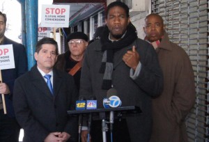 Councilmember Jumaane D. Williams, with Councilmember Vincent Gentile (l) and Brooklyn Borough President Eric Adams (r), announces new legislation to combat illegal home conversion. Image credit: Ernest Skinner/NYC Council 