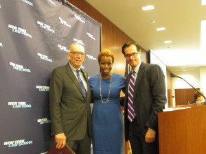 NYCHA Chair & CEO Shola Olatoye standing with NYLS Professor & the Center for New York City Law Director Ross Sandler (left) and NYLS President and Dean Anthony Crowell (right). Image credit: CityLand 