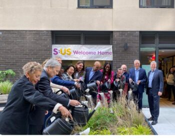 City officials and project partners celebrate the new supportive and affordable housing development on Jerome Avenue. Image Credit: HPD/Services for the Underserved.